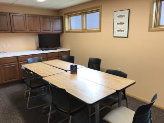 Trout River Room with 4 tables and 8 chairs