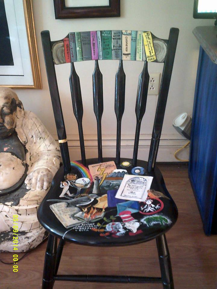Chair with painted books on it for auction