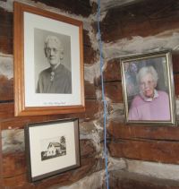 Portrait pictures of Katie Flowers on a cabin wall.